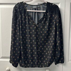 Black blouse with lace sleeves and flowered print